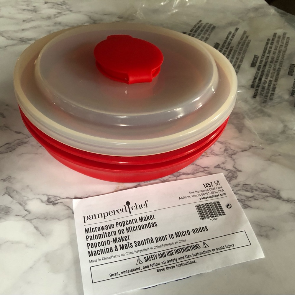 Pampered Chef small microwave popcorn popper. Never used. Color red. Collapsible